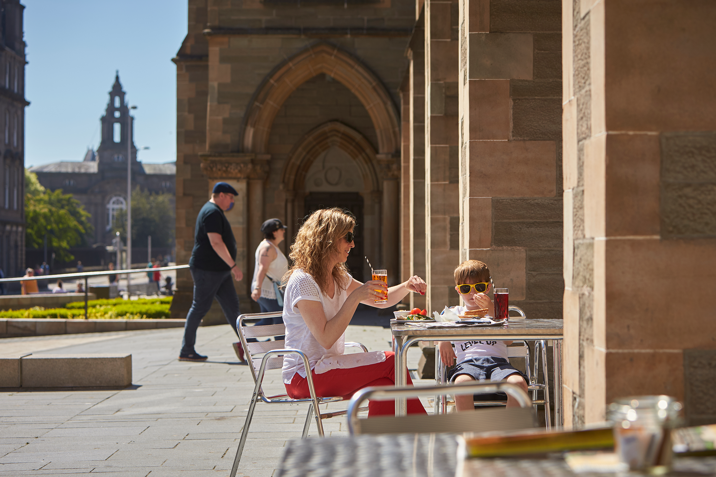 Woman and child dining outside McManus Galleries