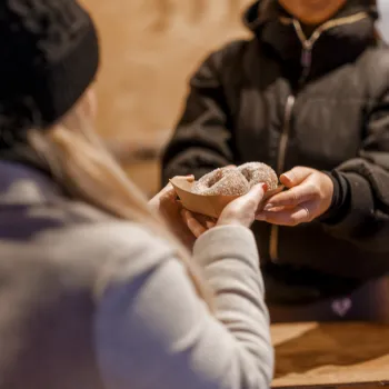 Woman handing over street food