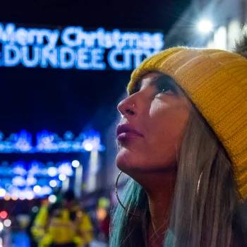 Woman wearing beanie outside at Christmas