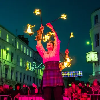 Fire performer juggling on stage