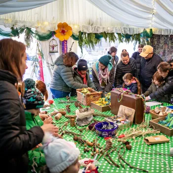 People making things inside the craft tent