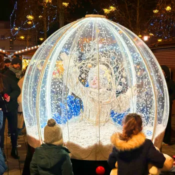 A princess sitting in a living snow globe