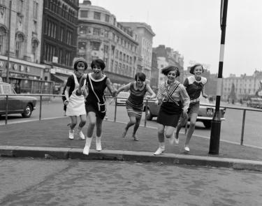 Mary Quant and her Ginger Group of girls in Market Street Manchester.  February 1966. Photo by Howard Walker - Mirrorpix Getty Images