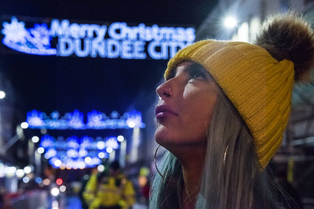 Woman wearing beanie at Christmas lights